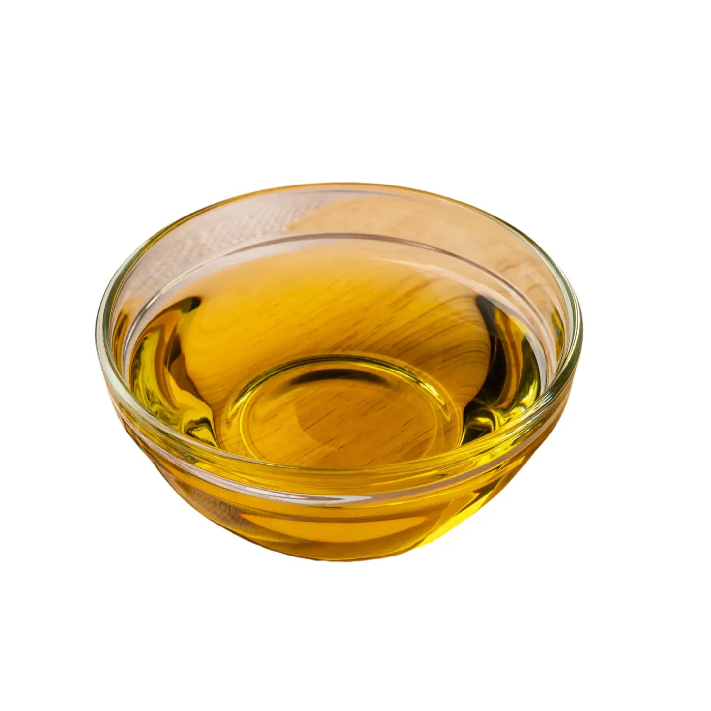 A small glass bowl filled with golden-yellow calendula essential oil, reflecting light and highlighting its purity and rich botanical essence.