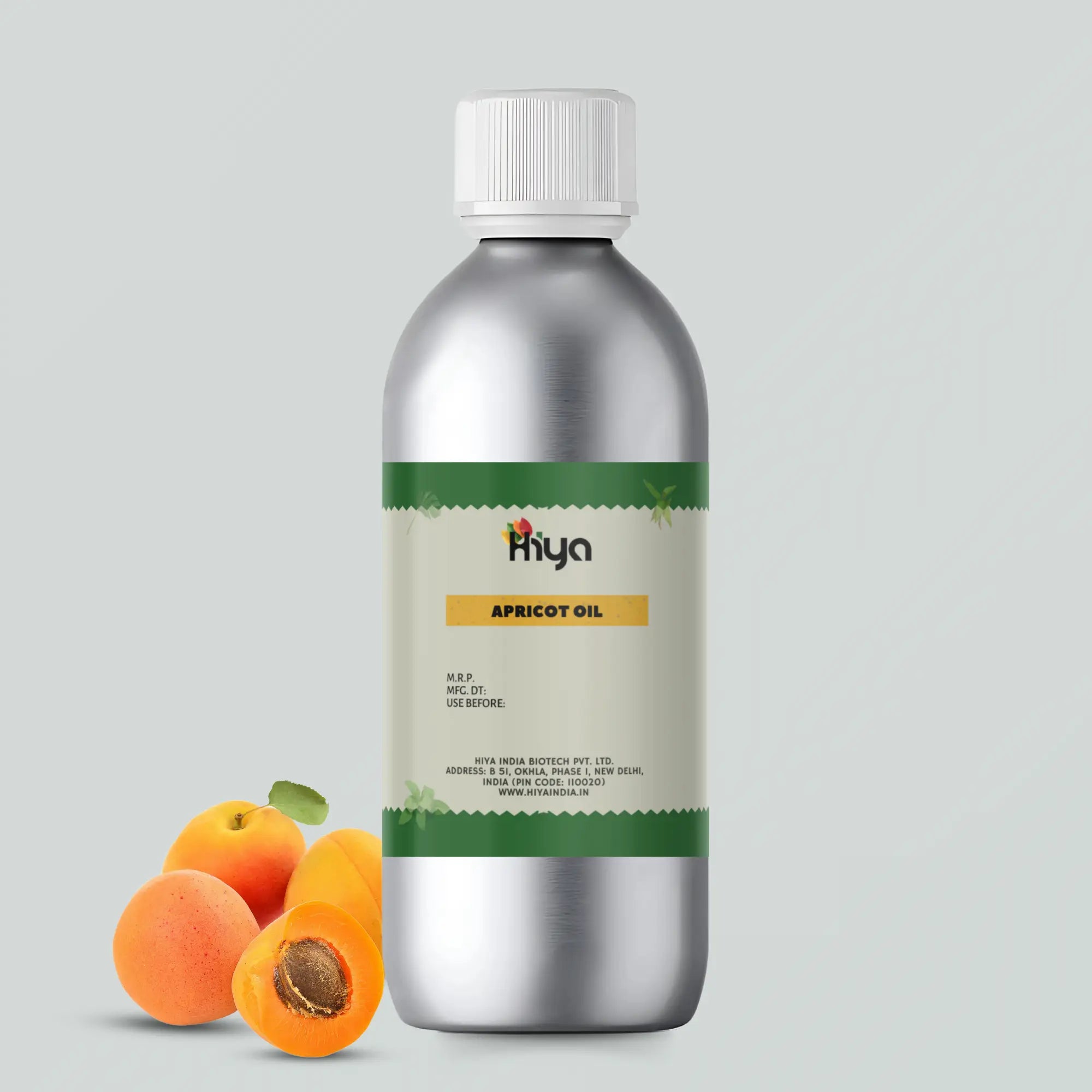 A metallic bottle labeled filled with Apricot Oil. Three apricots, one cut in half to show the seed, are placed in the foreground, emphasizing the natural and fresh aspect of the product.