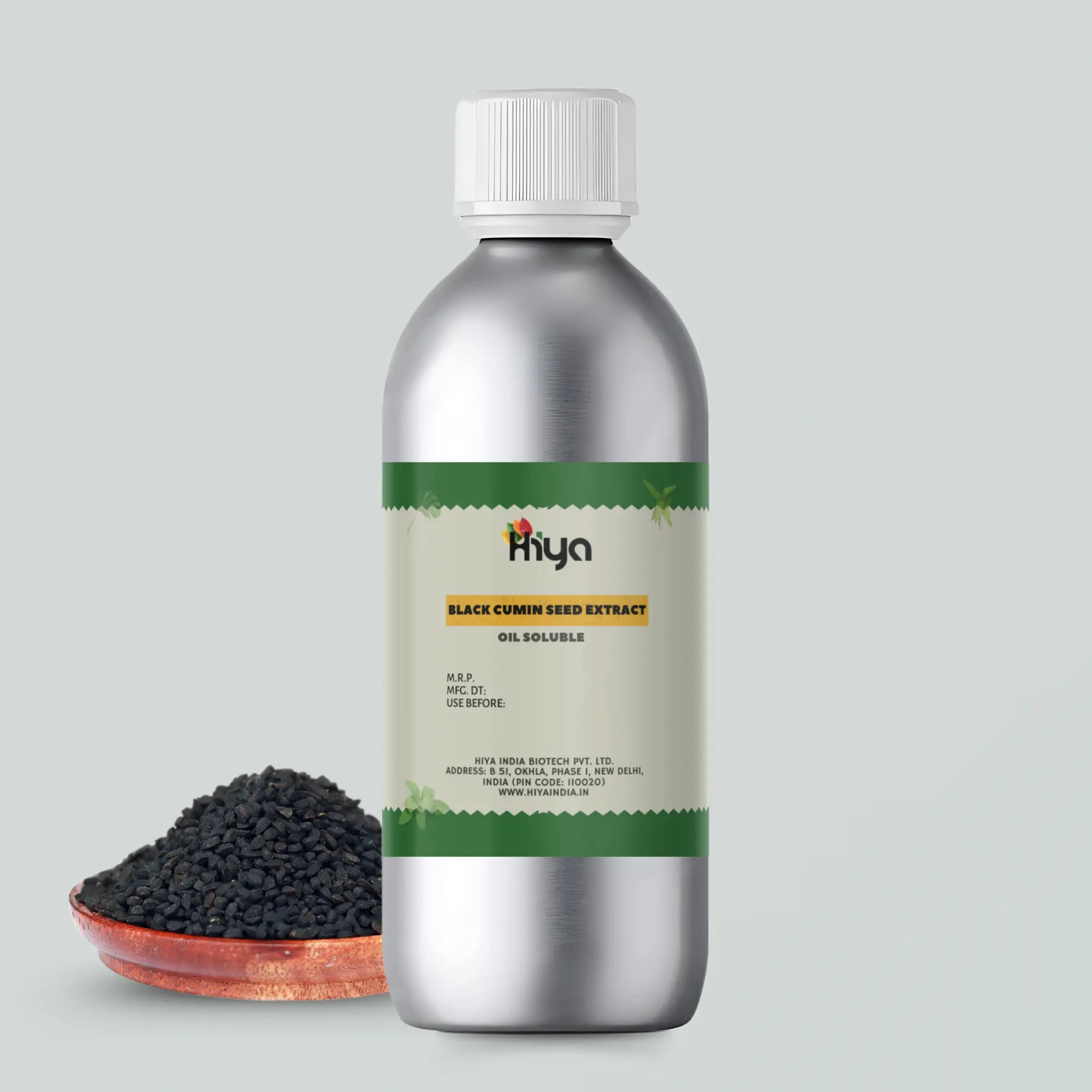 Hiya Black Cumin Seed Extract bottle with a metallic finish and white cap, placed beside a small bowl of black cumin seeds.