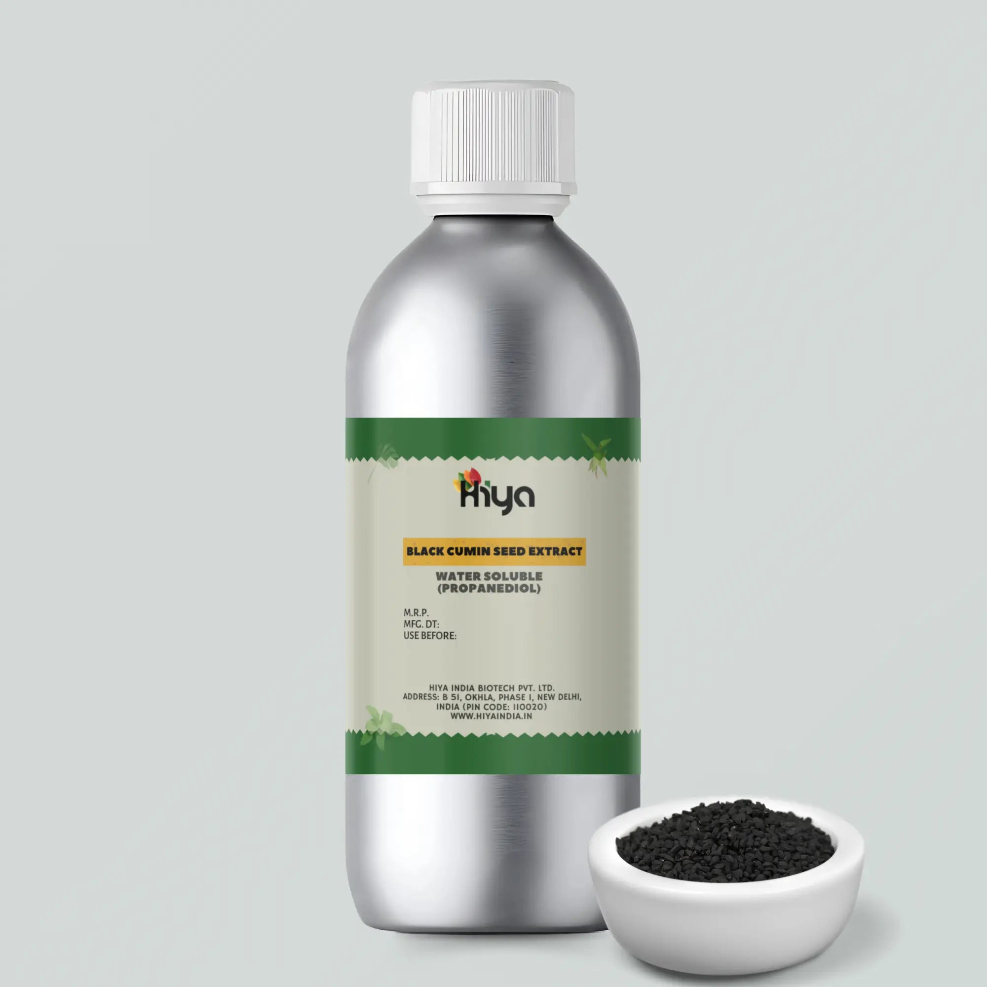 A metallic silver bottle labeled "Hiya Black Cumin Seed Extract Water Soluble (Propanediol)" stands upright. Beside it, a small bowl is filled with black cumin seeds.