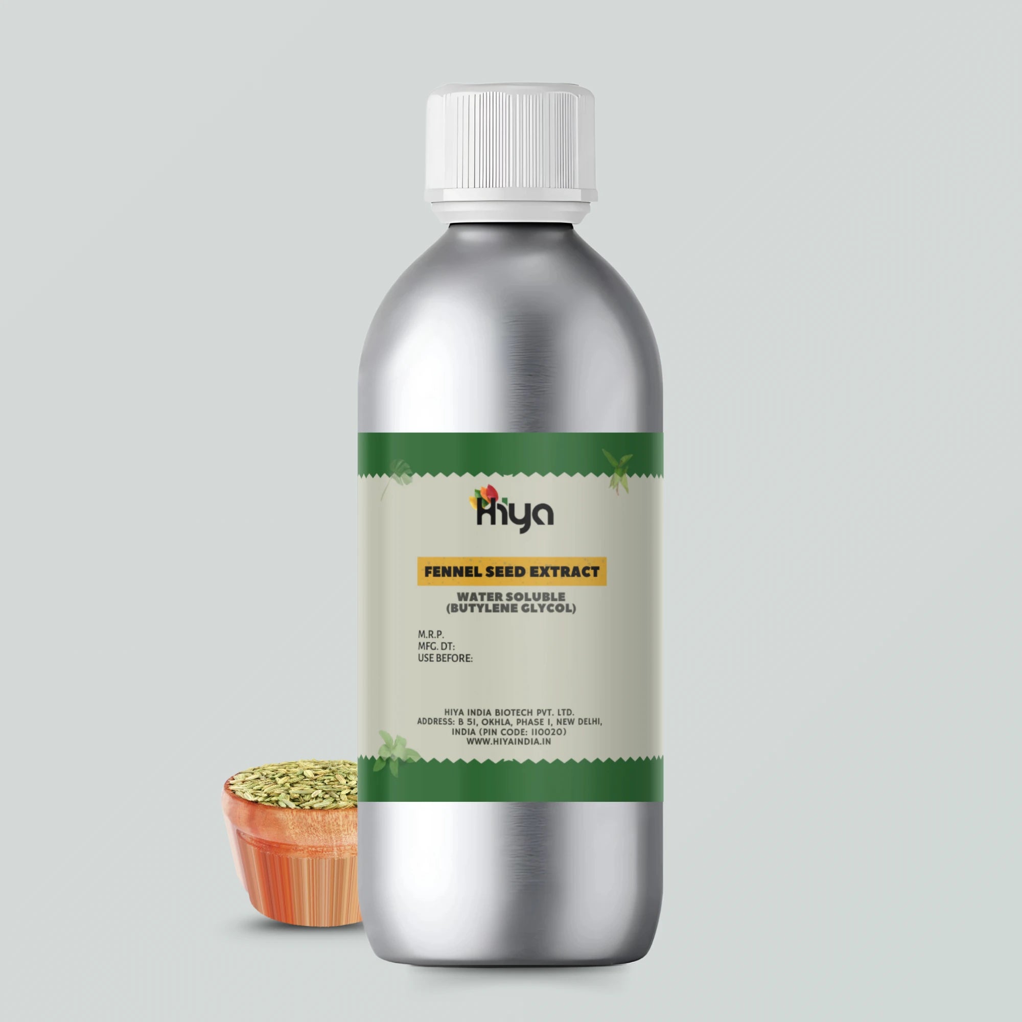 A metallic bottle labeled "Hiya Fennel Seed Extract Water Soluble (Butylene Glycol)" with a silver cap. A small container filled with fennel seeds is placed beside the bottle.