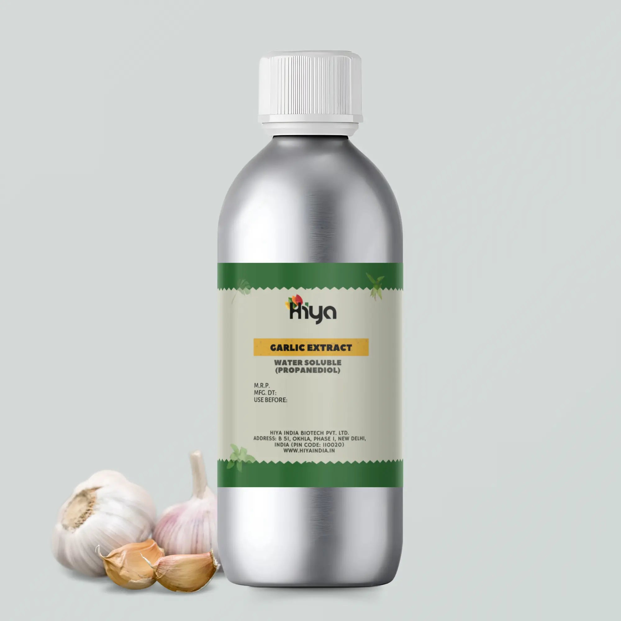 A silver bottle labeled "Hiya Garlic Extract Water Soluble (Propanediol)" stands upright. The label includes product details such as manufacturing information and expiration date. To the side, whole garlic bulbs and separated garlic cloves rest on the surface.