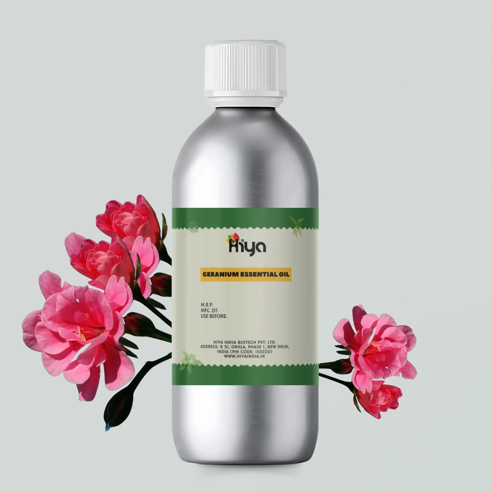 Hiya Geranium Essential Oil metallic bottle with white cap and green-bordered label, placed next to pink geranium flowers. The product label highlights Hiya India Biotech Pvt. Ltd., based in New Delhi, India, along with its website www.hiyaindia.in.. Ideal for aromatherapy and natural wellness.