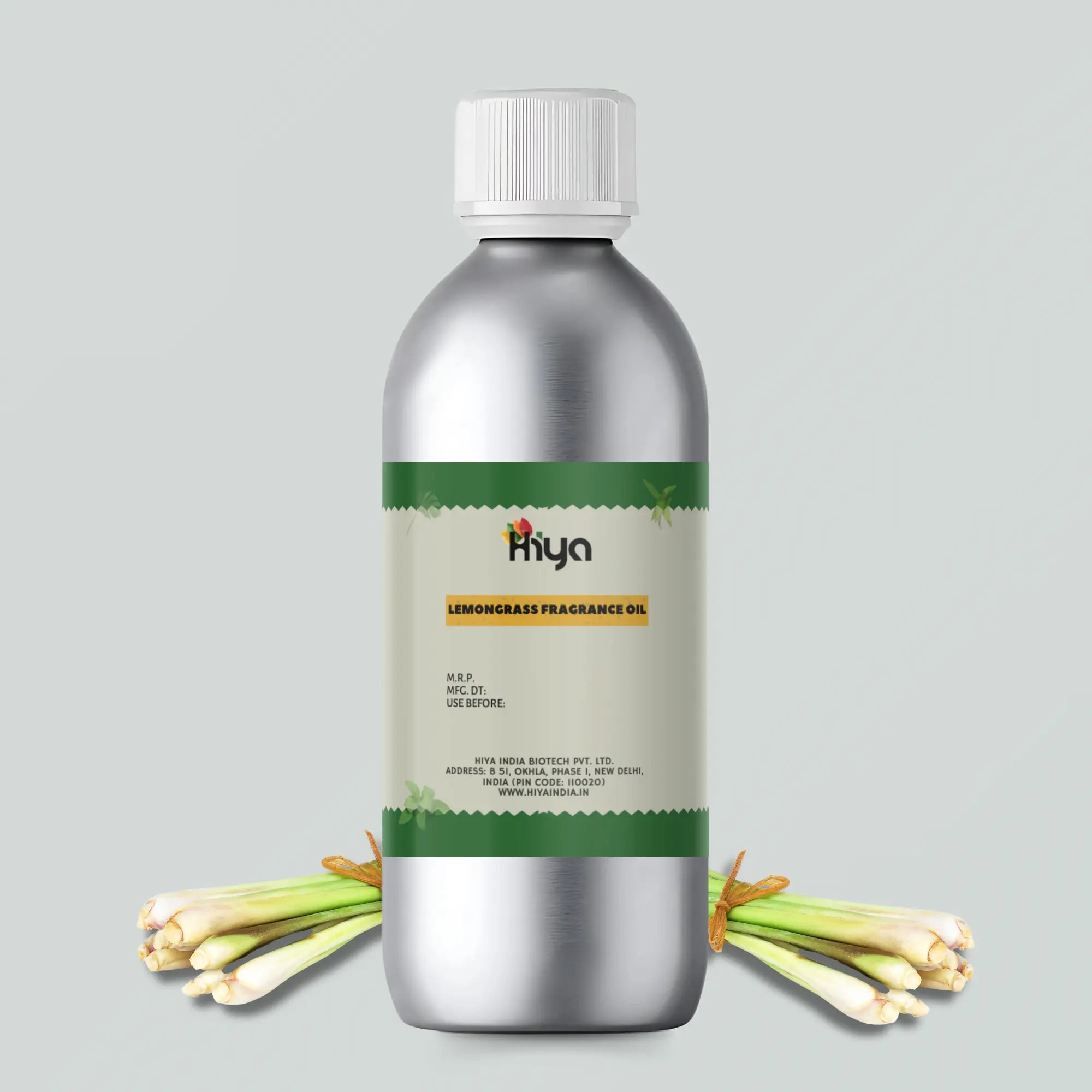 A silver metallic bottle labeled 'Hiya Lemongrass Fragrance Oil,' surrounded by fresh lemongrass stalks, emphasizing its natural and aromatic qualities.