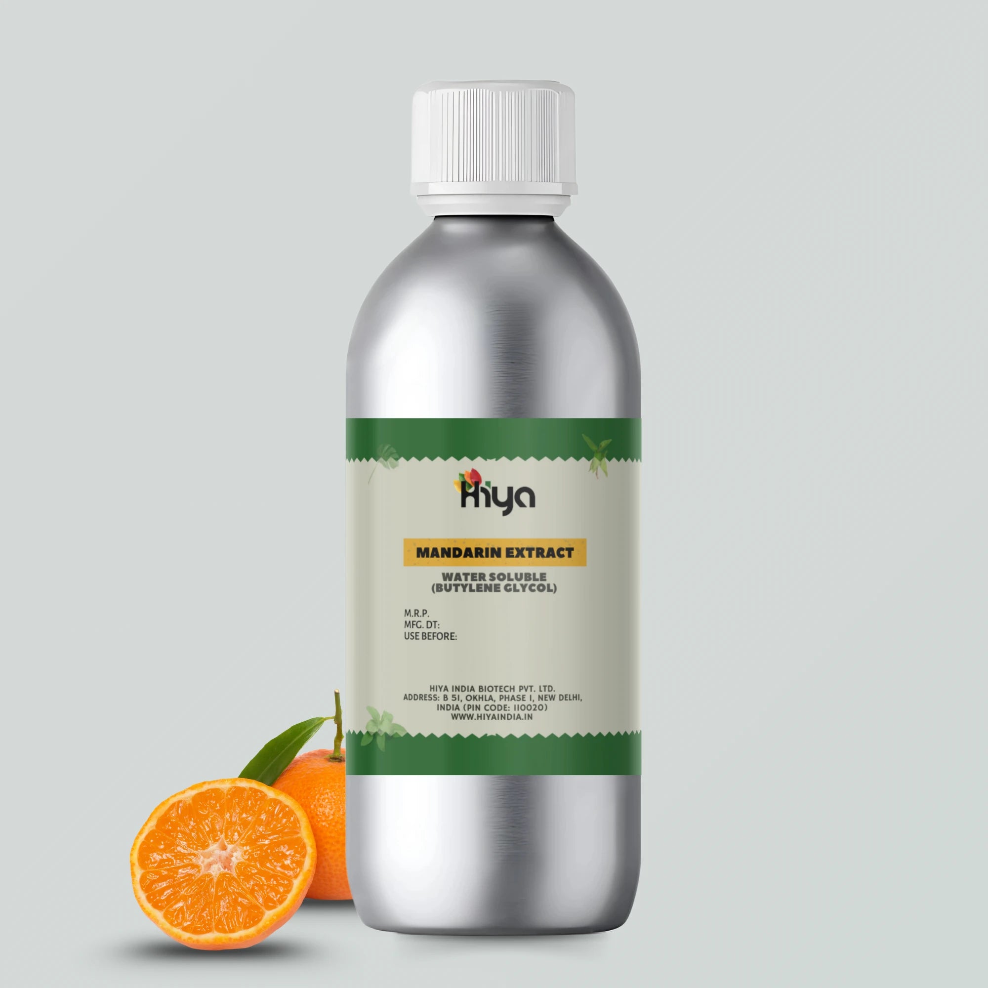 A metallic bottle with a white cap labeled 'Hiya Mango Extract Water Soluble (Butylene Glycol).' Three ripe mangoes sit beside the bottle, adding a fresh and vibrant touch