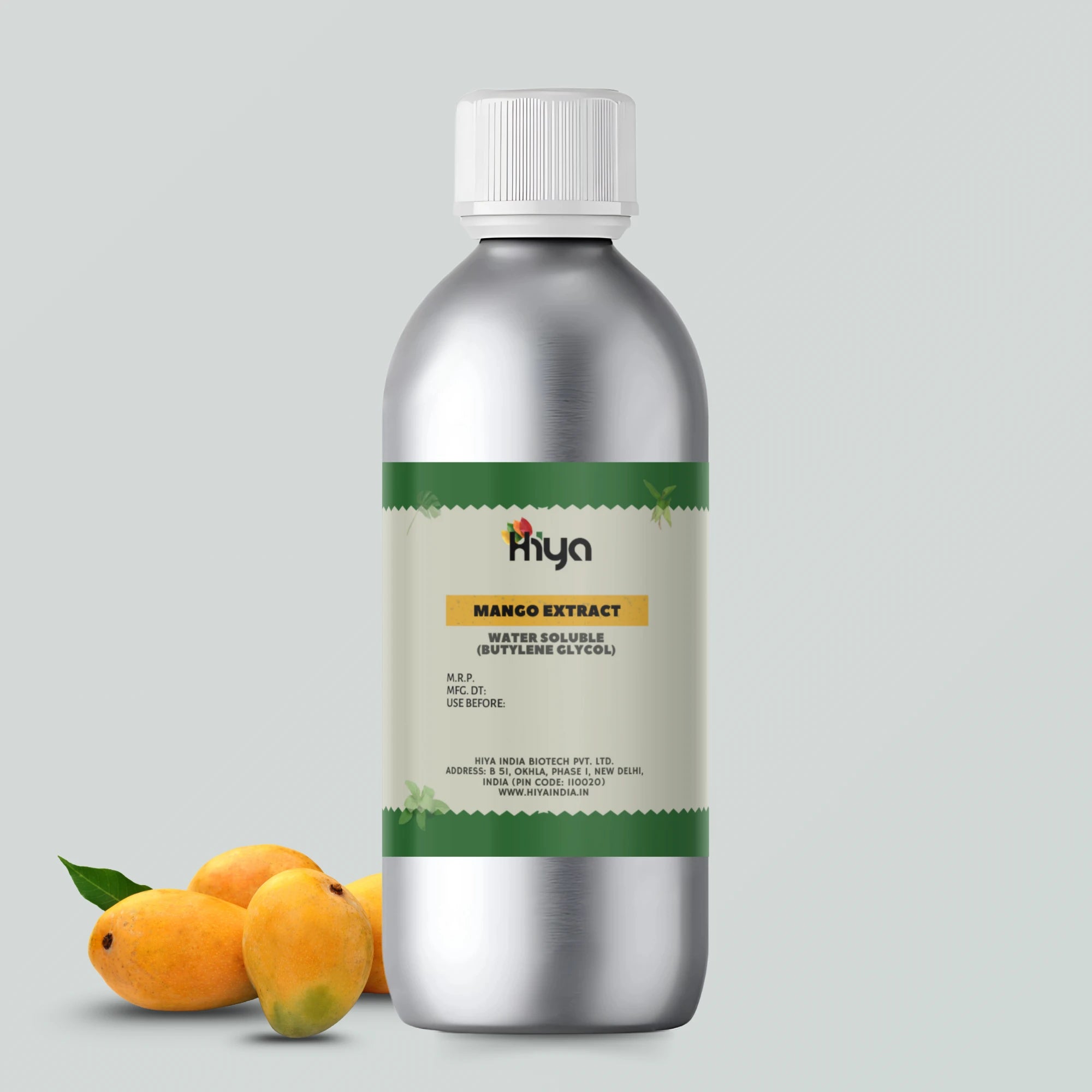 A silver bottle with a white cap labeled 'Hiya Mango Extract Water Soluble (Butylene Glycol).' The label includes product details and manufacturing information from Hiya India Biotech Pvt. Ltd., New Delhi, India. Three fresh mangoes are placed beside the bottle, adding a vibrant touch.