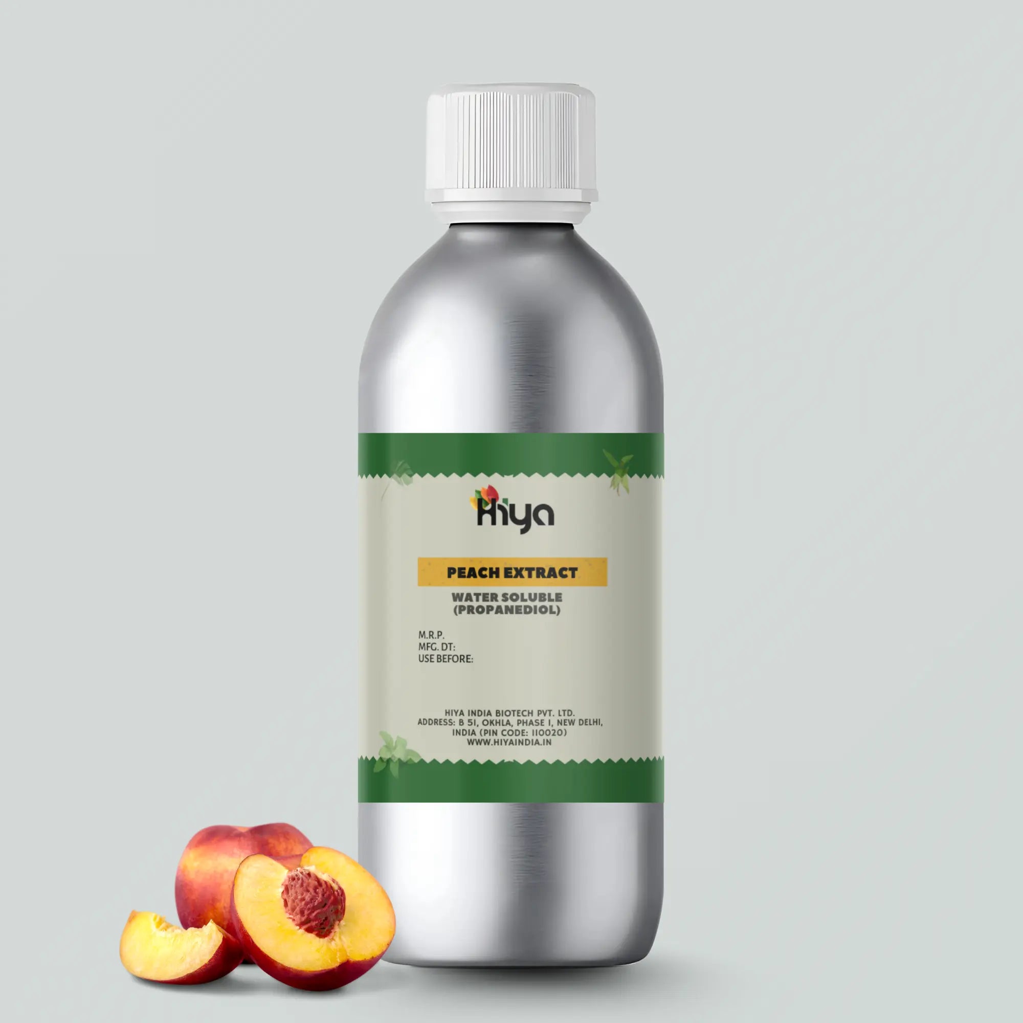 A silver metallic bottle labeled "Hiya Peach Extract Water Soluble (Propanediol)" with two peach halves beside it, one showing the pit and the other showing the flesh.