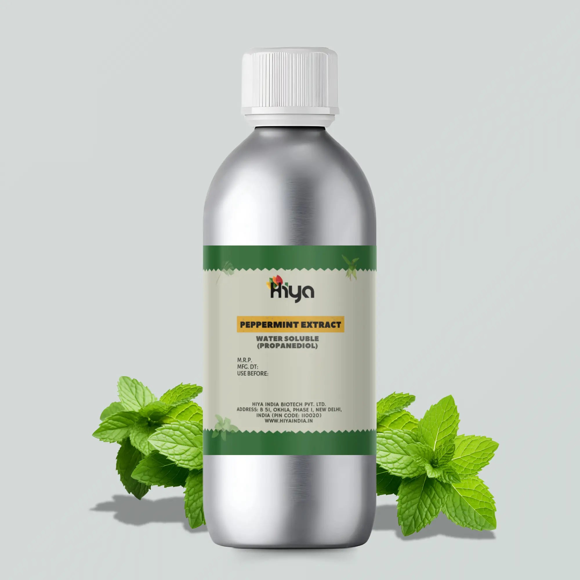 A silver bottle with a white cap labeled "Hiya Peppermint Extract Water Soluble (Propanediol)" is displayed. The label includes the manufacturer's details. Fresh peppermint leaves are placed around the base of the bottle.
