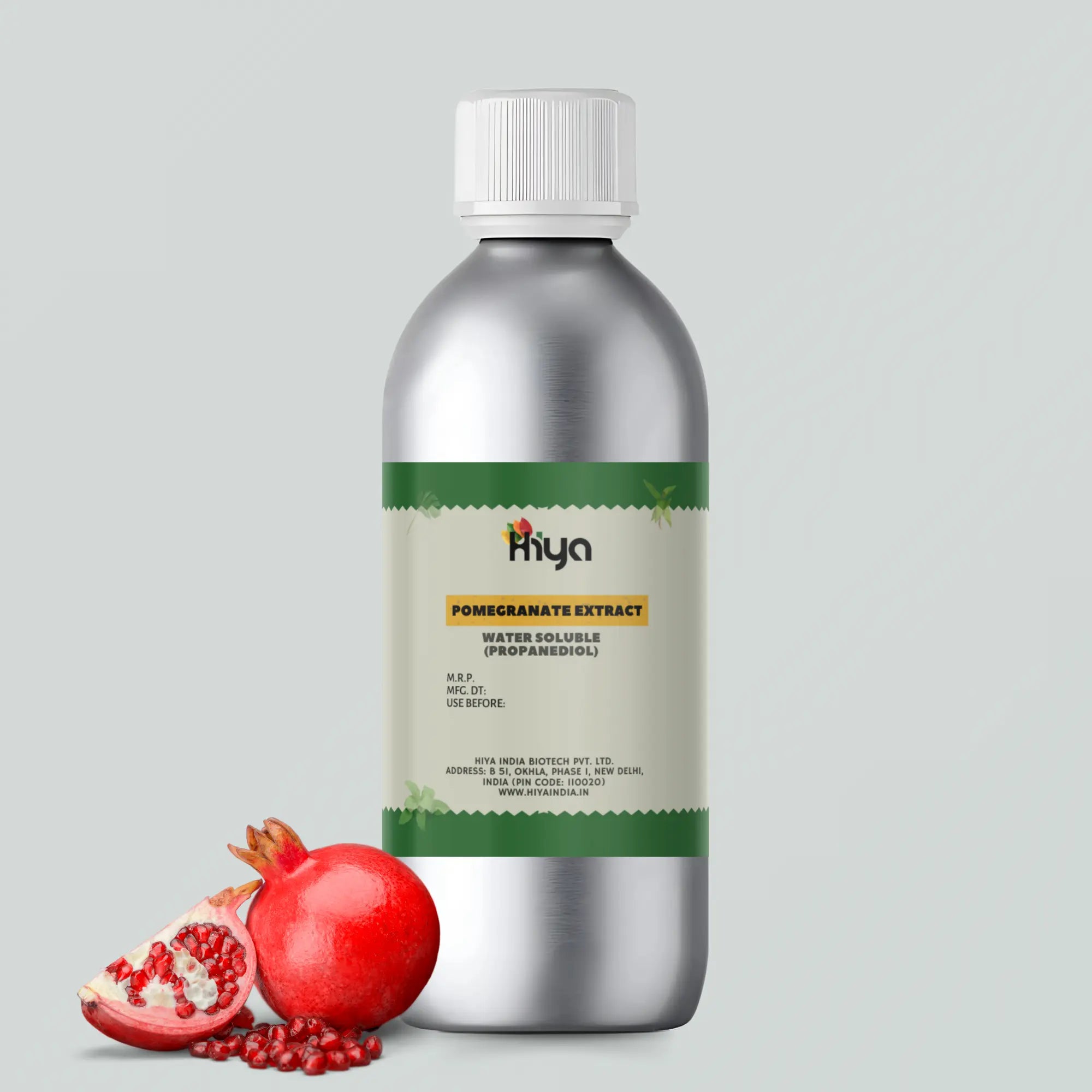 A metallic bottle labeled "Hiya Pomegranate Extract Water Soluble (Propanediol)" with a whole pomegranate and a sliced one showing seeds beside it.