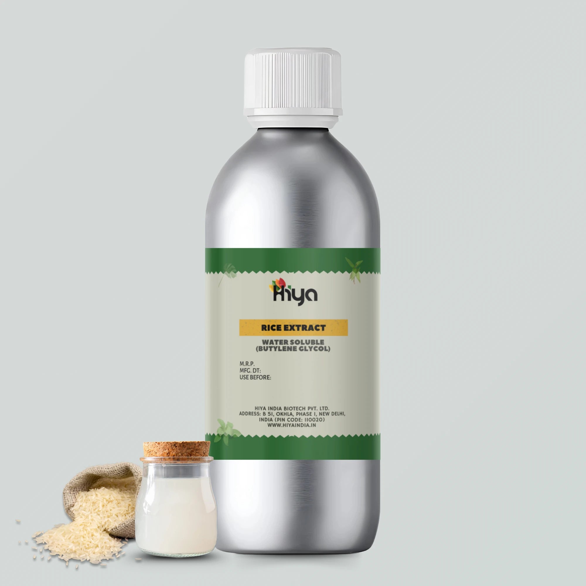A metallic bottle labeled "Hiya Rice Extract Water Soluble (Butylene Glycol)" with a white cap. A small jar contains a white liquid, while a burlap sack spills grains of rice.