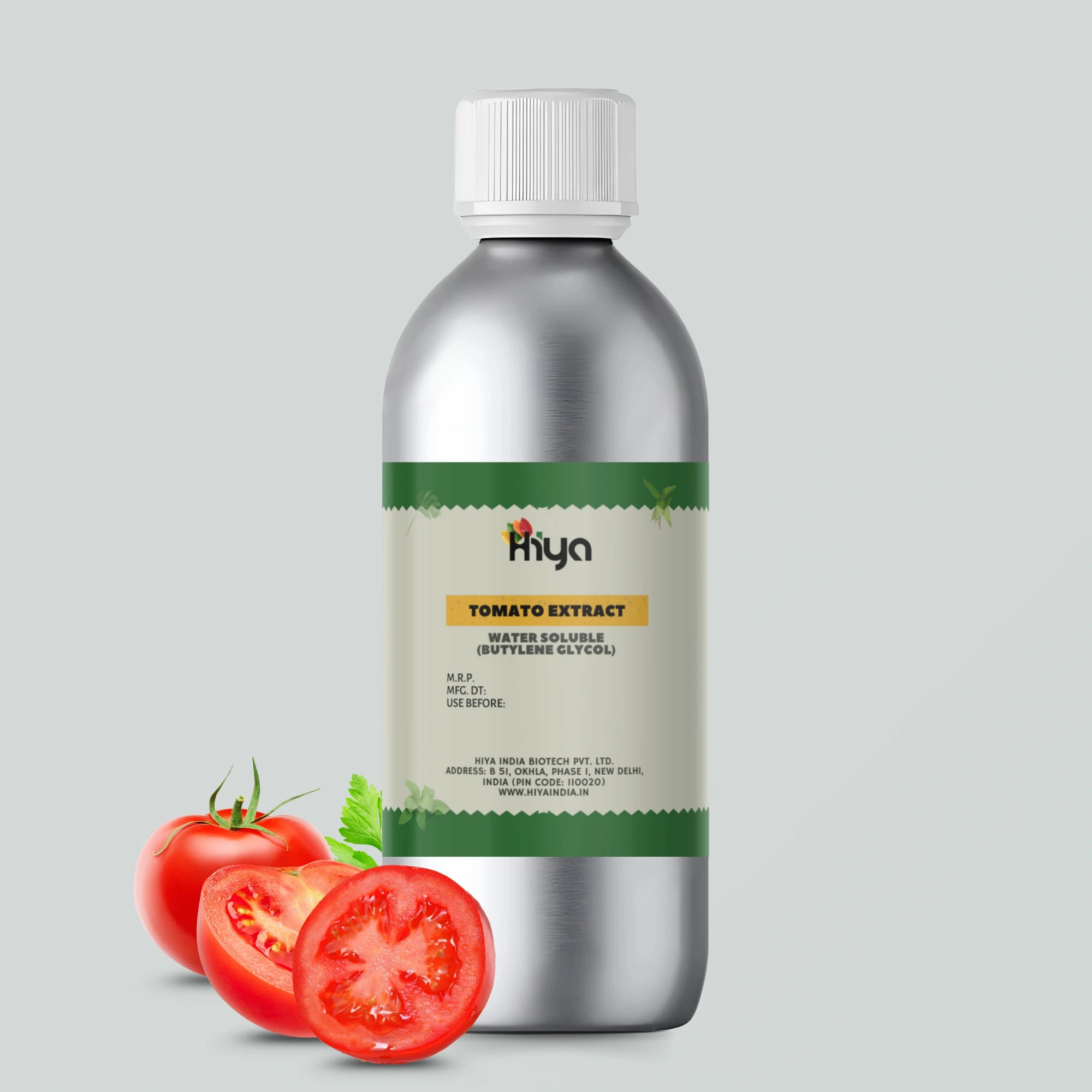 A metallic bottle labeled 'Hiya Tomato Extract Water Soluble (Butylene Glycol),' displayed alongside a whole tomato and a sliced tomato.