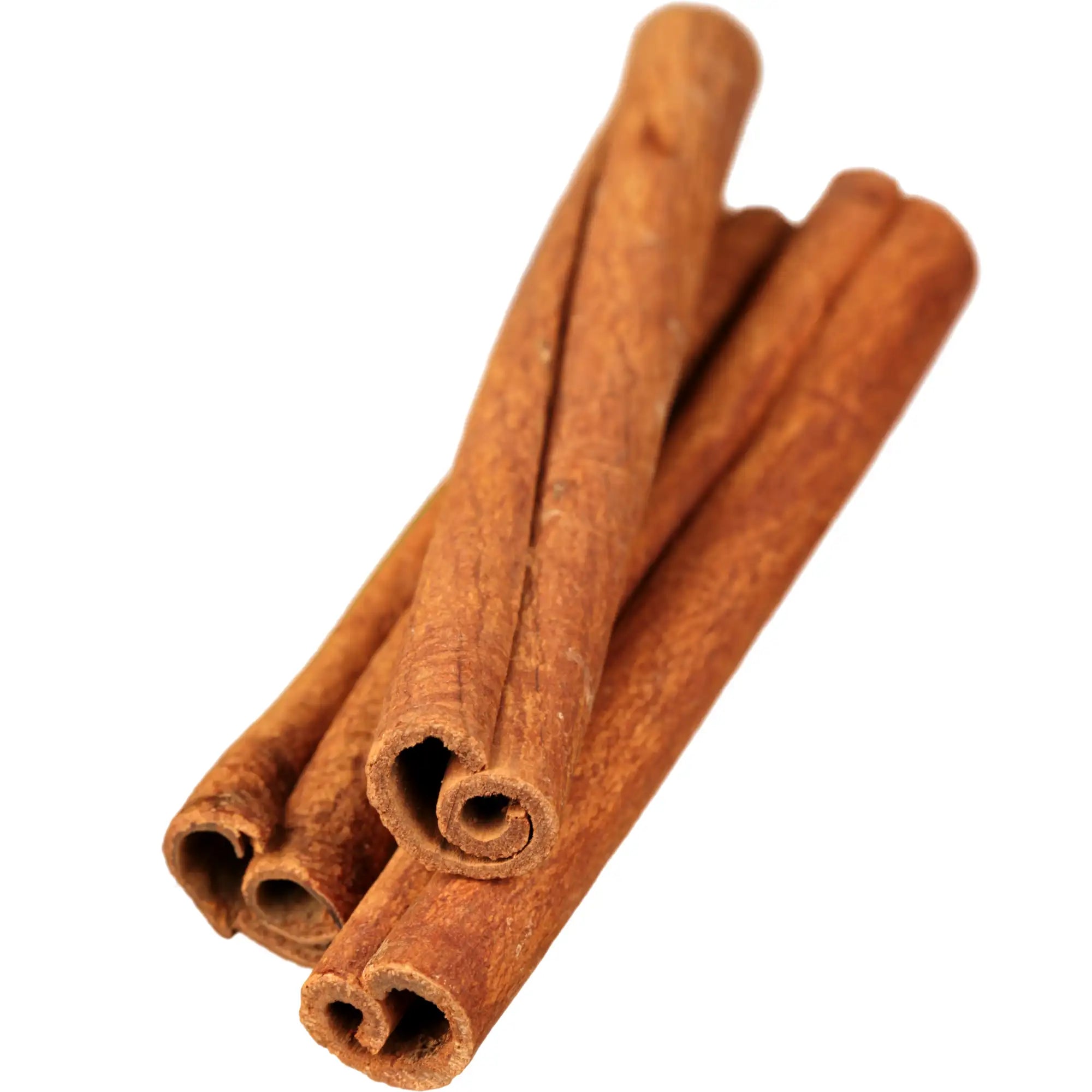 A close-up of cinnamon sticks, showing their curled, textured surface and rich brown color, isolated on a white background, used by Hiya to make cinnamon essential oil.